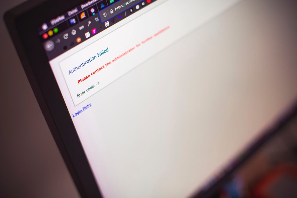 Laptop displaying error message, "Authentication Failed"