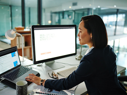 woman working at her desk on her laptop