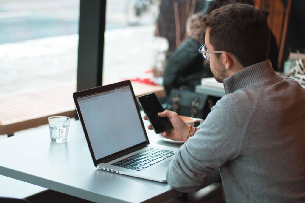 Man using multi-factor authentication (MFA) to log onto his laptop.