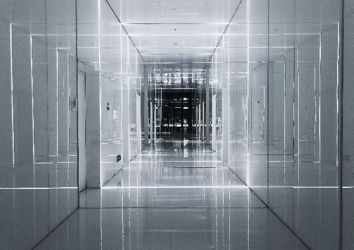 Black and white hallway with white rectangle overlays.
