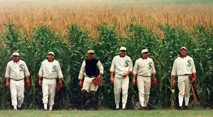 Characters in Field of Dreams walking out of a cornfield.