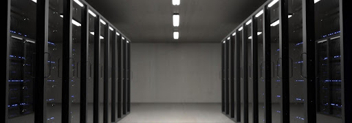 Large server room illuminated by overhead lights