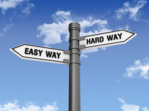 Directional Sign with EASY HARD WAY and Sky
