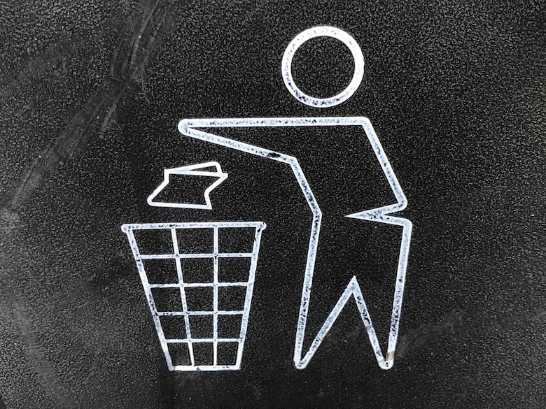 Chalk-type drawing of a person throwing trash in a waste bin.