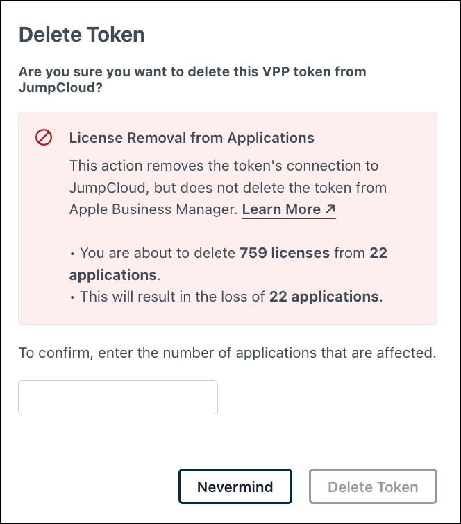 JumpCloud Delete Token confirmation dialog with license removal warning.